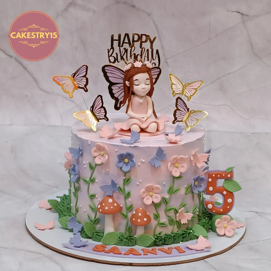 Fairy princess 5th birthday cake eggless kids birthday cake in Noida with fondant fairy and floral design