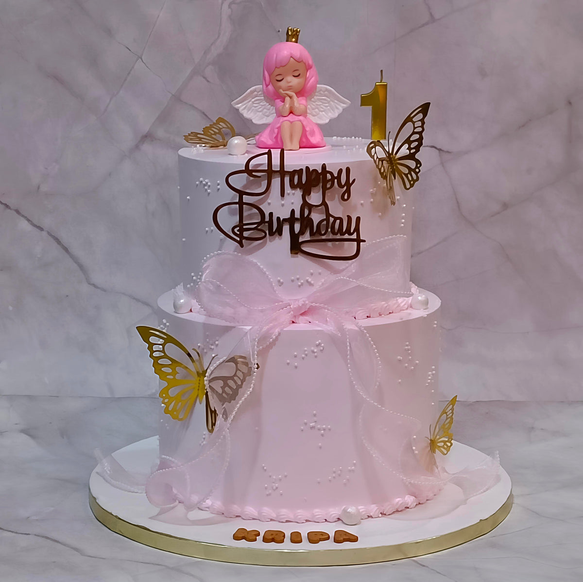 Fairy theme kids birthday cake with butterflies and pink ribbon, a theme cake Noida option from our eggless cakes collection.