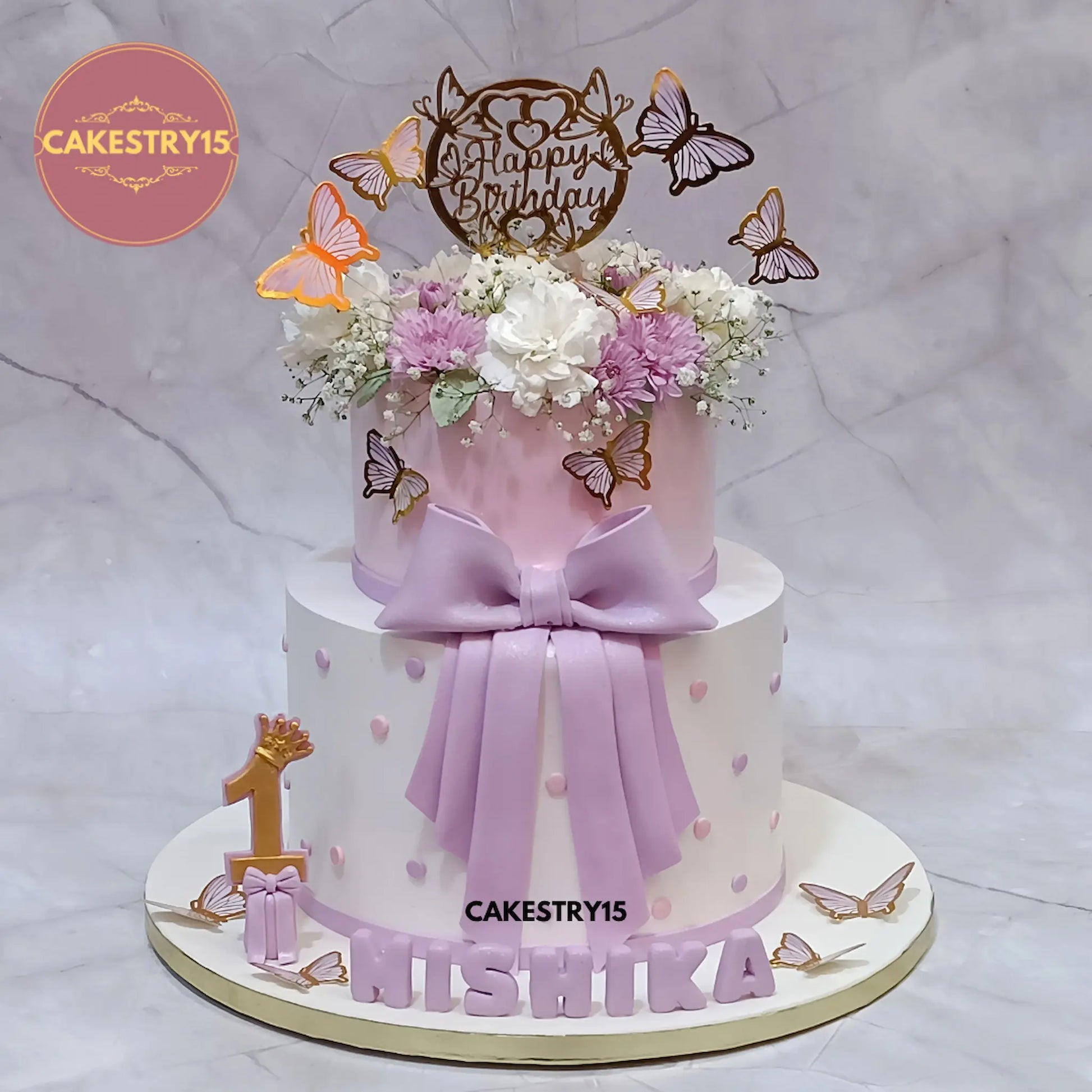 4kg butterscotch floral birthday cake with butterflies, fondant bow, and 3D name by Cakestry15 Noida