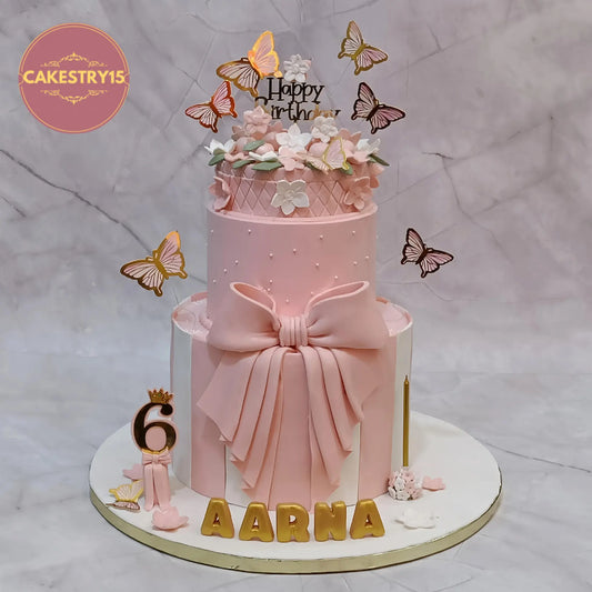Floral rotating kids birthday cake in choco vanilla with peach ivory fondant, butterflies and 3D name by Cakestry15 Noida