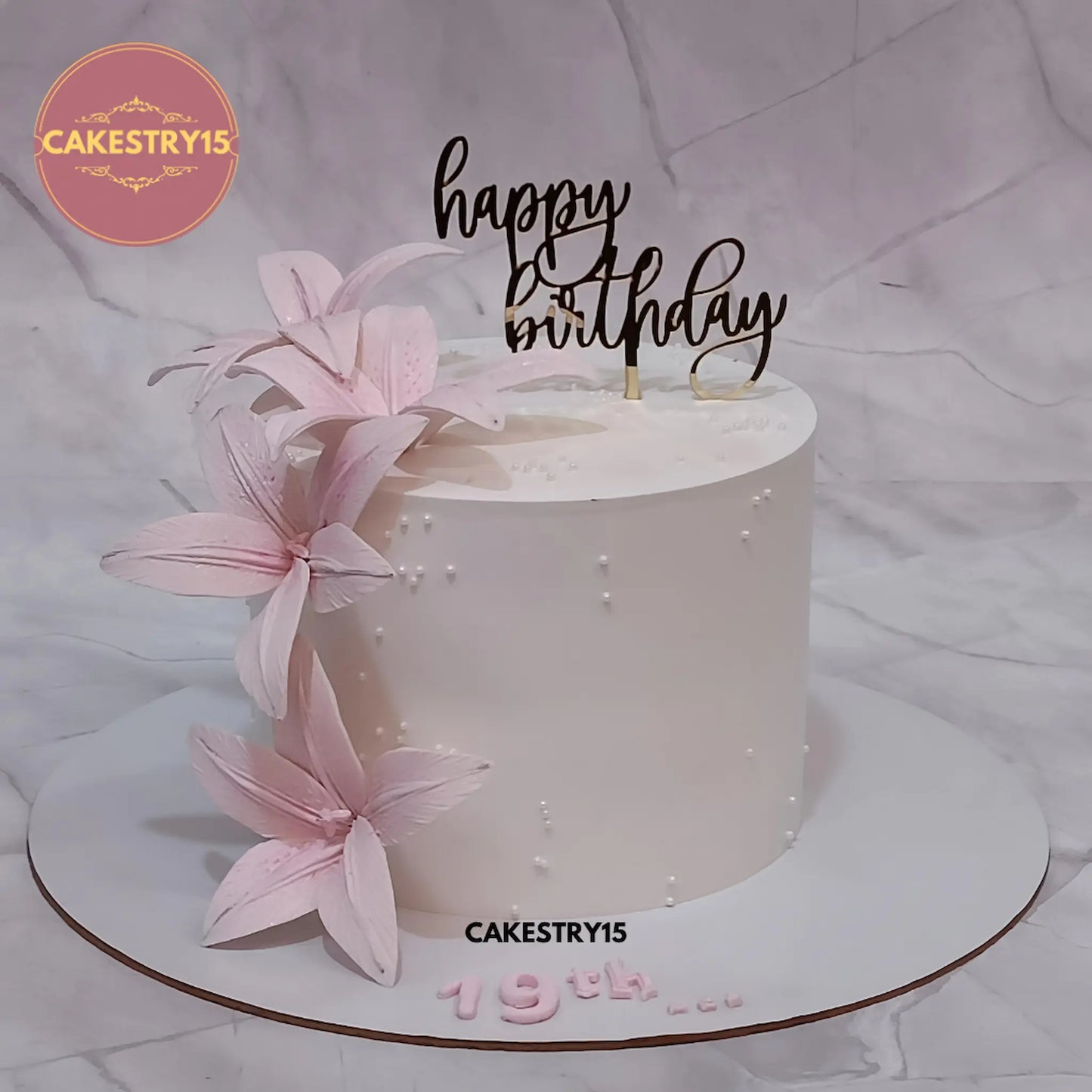 Elegant floral kids birthday cake with fondant lilies, premium theme cake Noida design from Cakestry15 eggless cakes collection.