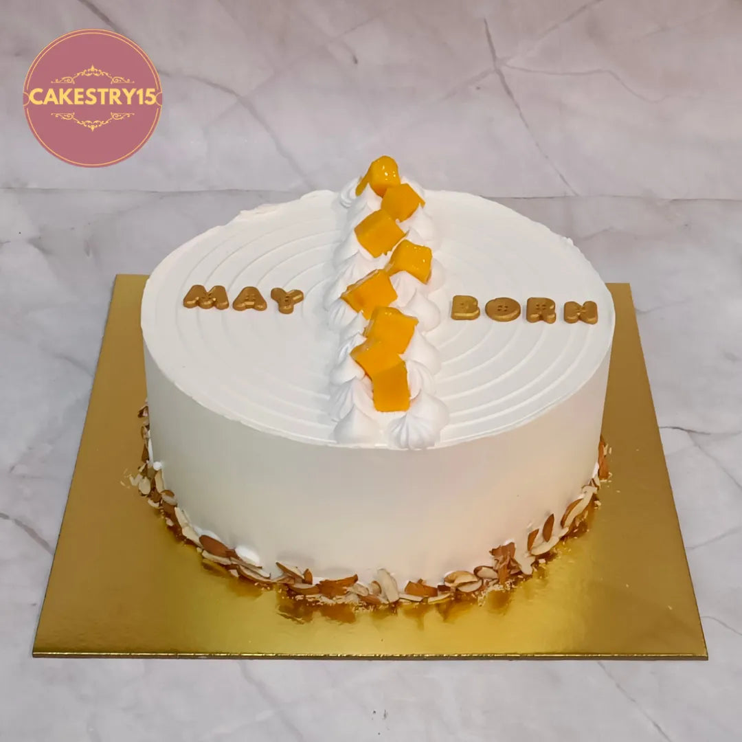 Premium eggless fresh fruit corporate celebration cake topped with seasonal mango, layered with pomegranate, kiwi and apple, perfect for office birthdays, anniversaries and corporate events in Noida.