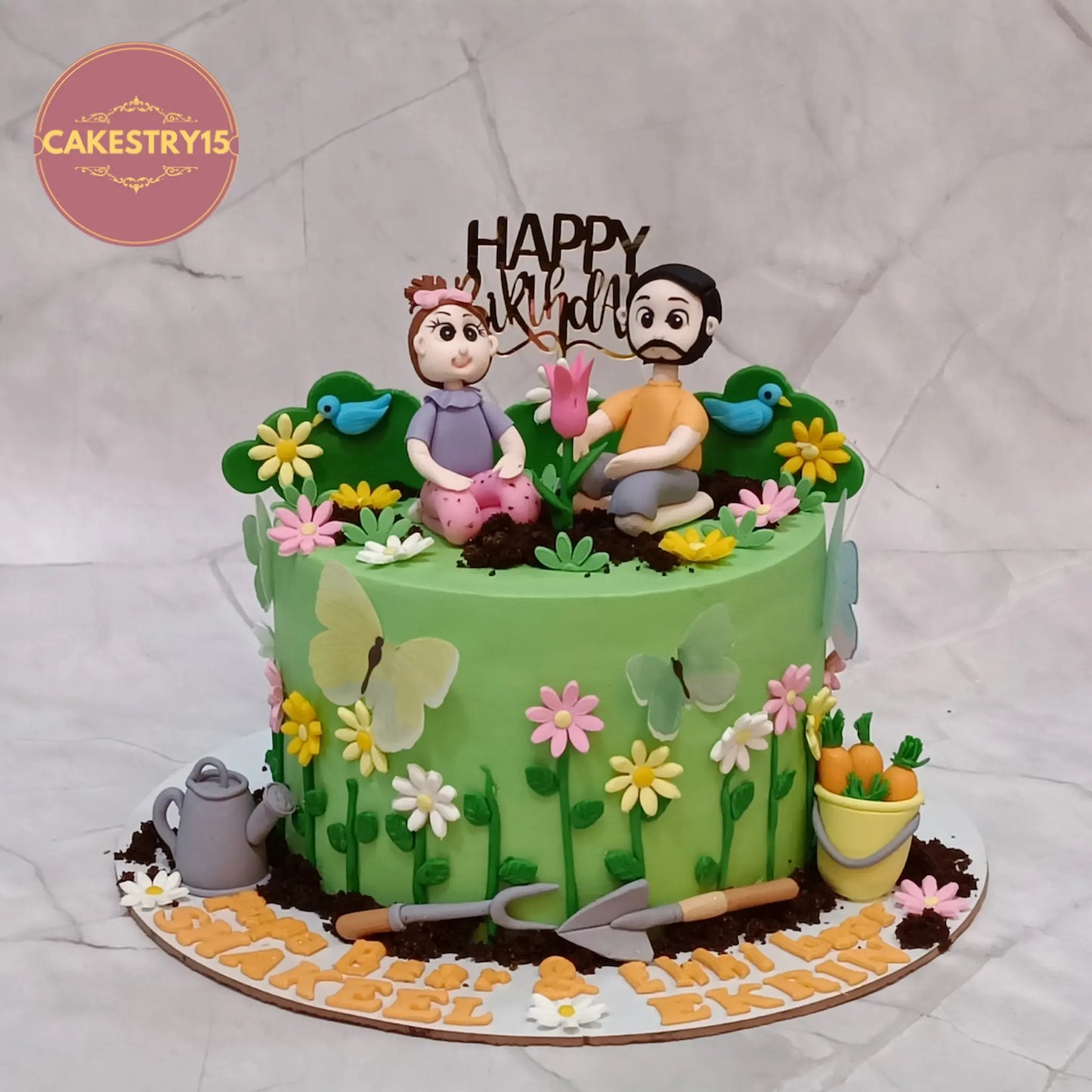 Eggless gardening theme birthday cake and theme cake Noida with flowers, butterflies, figurines, and chocolate flavour.