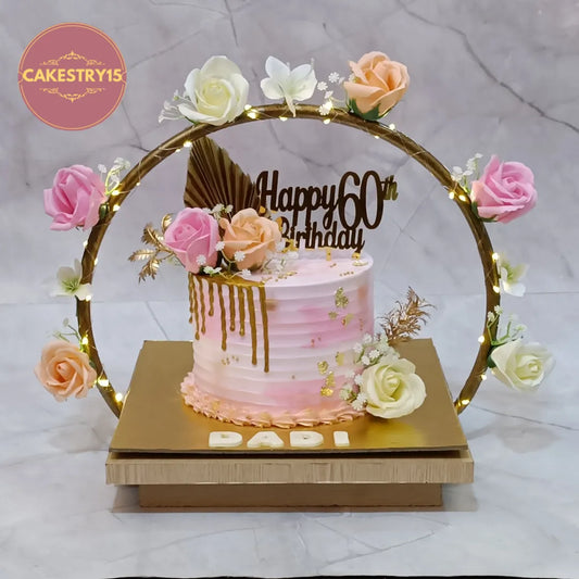 Elegant eggless cakes with golden floral detailing, perfect as a birthday cake and theme cake Noida customers order for milestone celebrations.