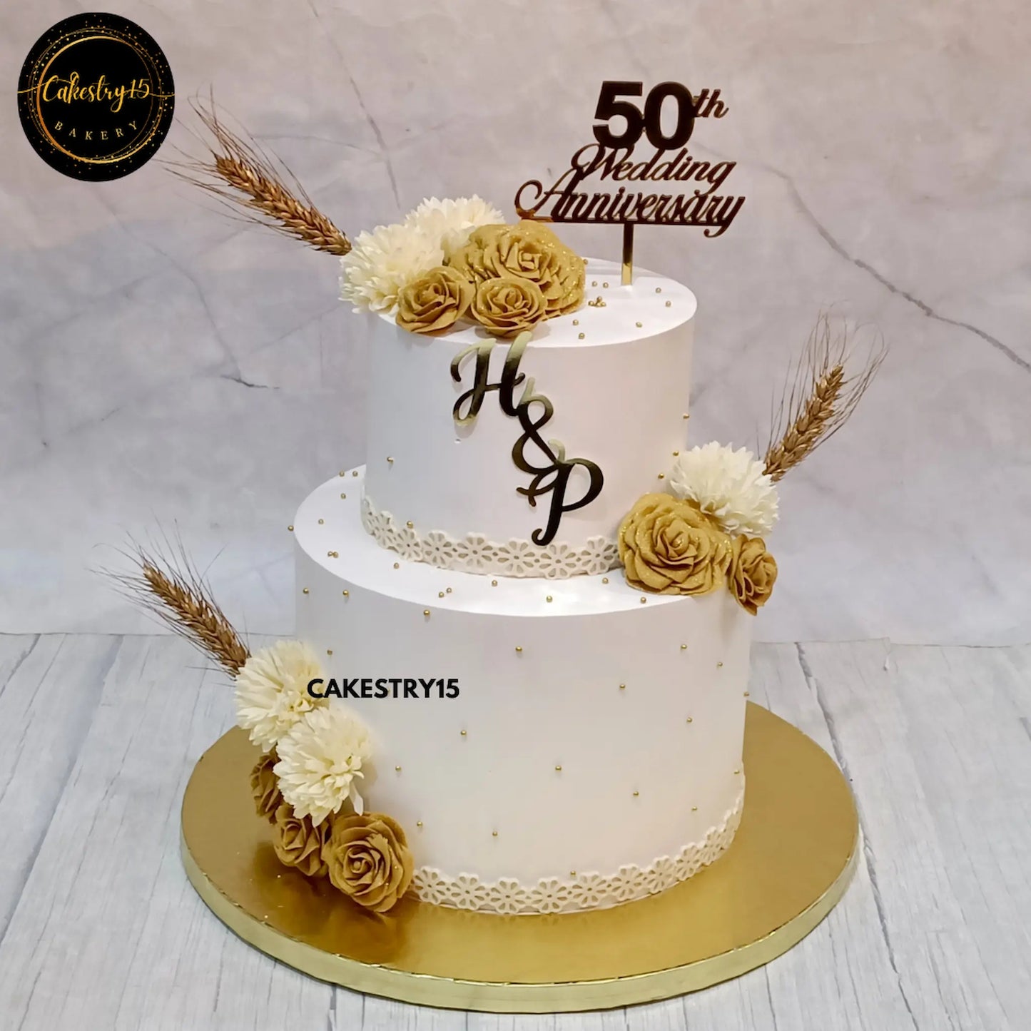 4kg two-tier black forest anniversary cake with golden fondant roses from Cakestry15