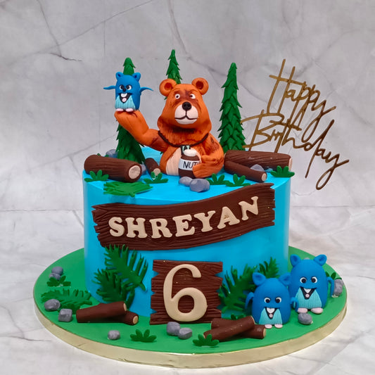 Grizzy and the Lemmings theme cake featuring bear and lemmings figurines, trees, wood logs and leaves for a kids birthday cake in Noida, made as an eggless cake.