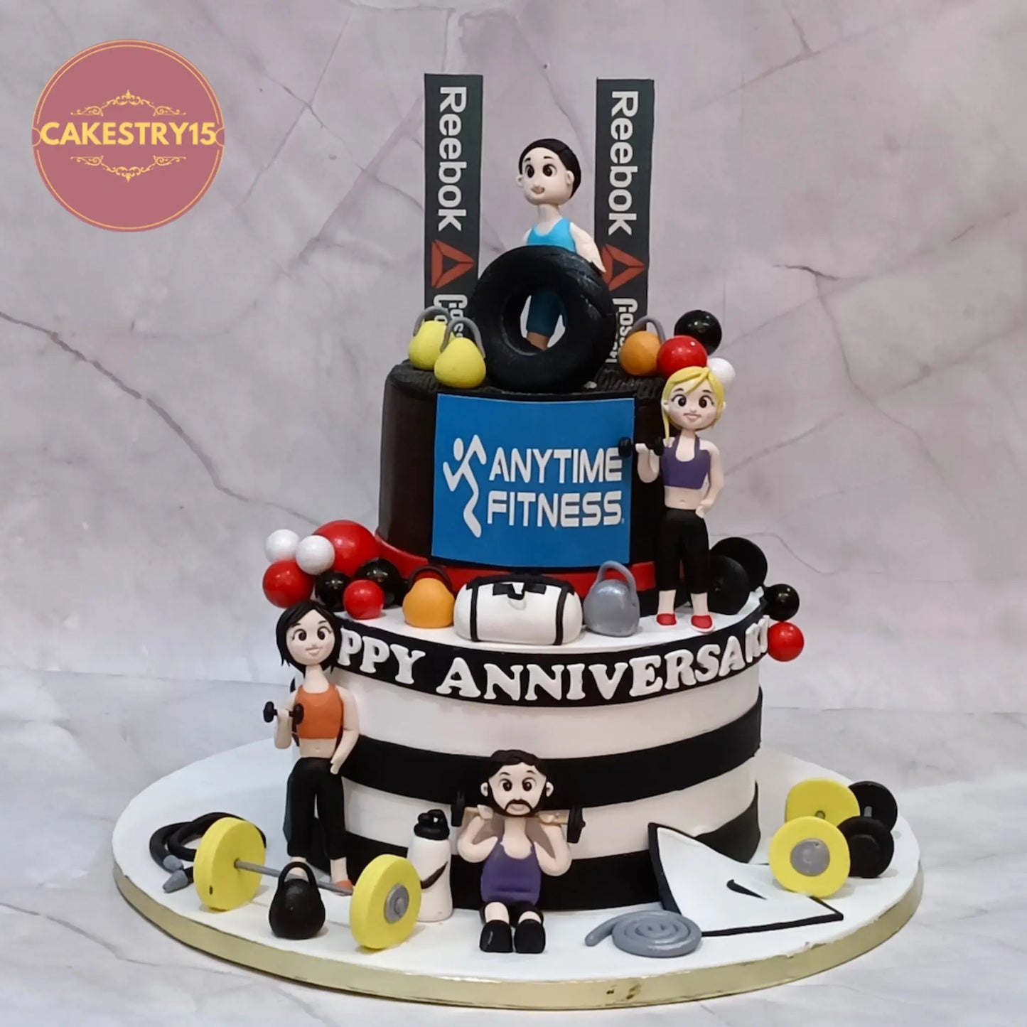Eggless gym theme anniversary cake with dumbbells weights figurines chocolate cake Noida custom fitness cake