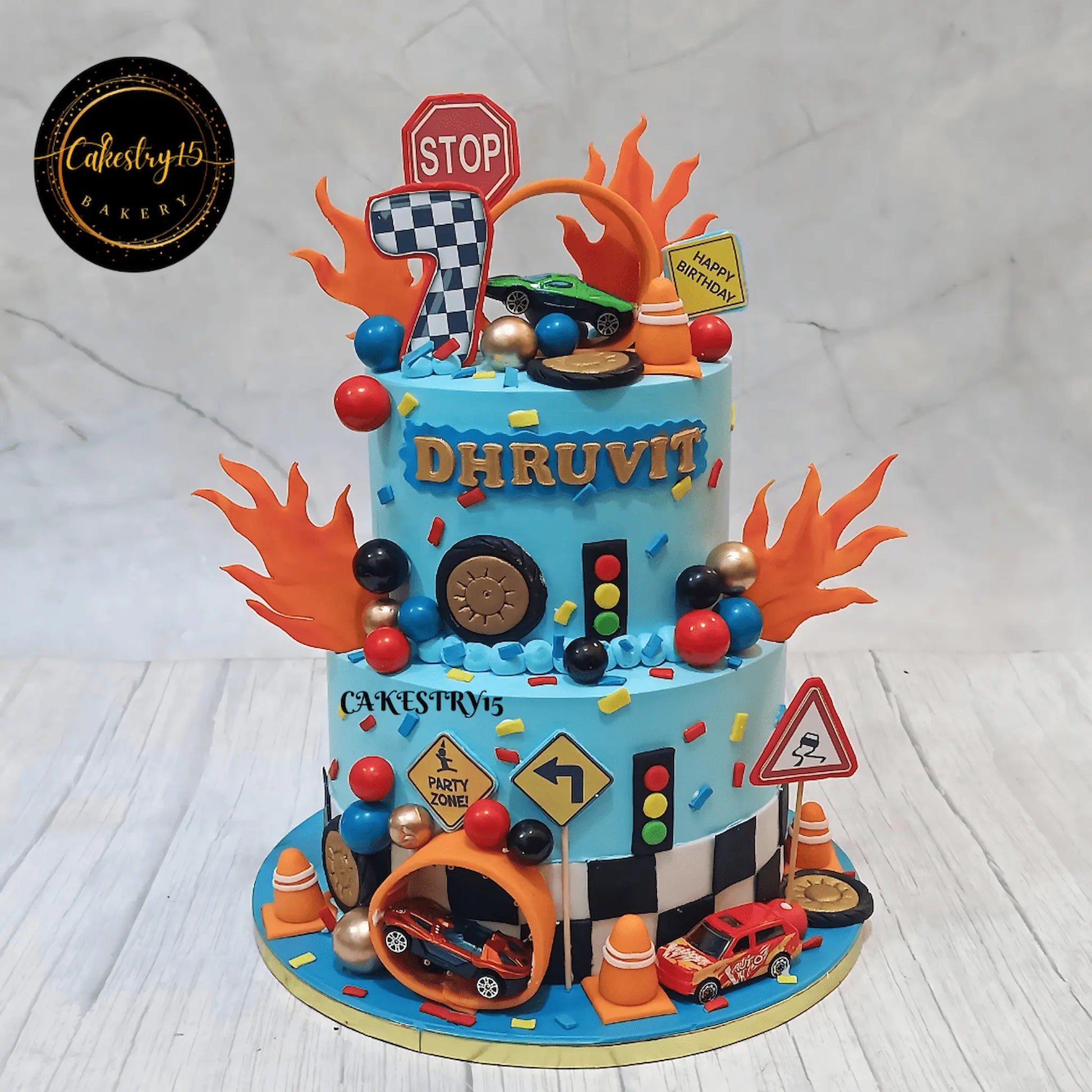 Eggless Hot Wheels theme kids birthday cake with blueberry flavour and racing design by Cakestry15 in Noida