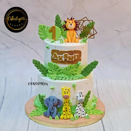 Eggless jungle theme kids birthday cake in Noida with fondant animals and pineapple flavour for a first birthday celebration.