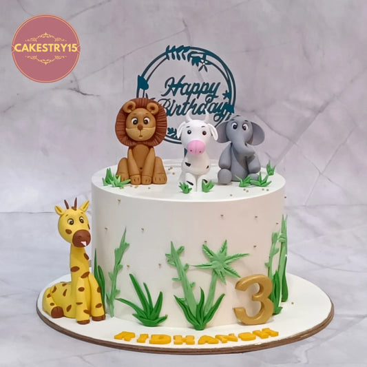 Eggless jungle explorers kids birthday cake featuring fondant animal figurines, a premium theme cake Noida families choose for special celebrations.