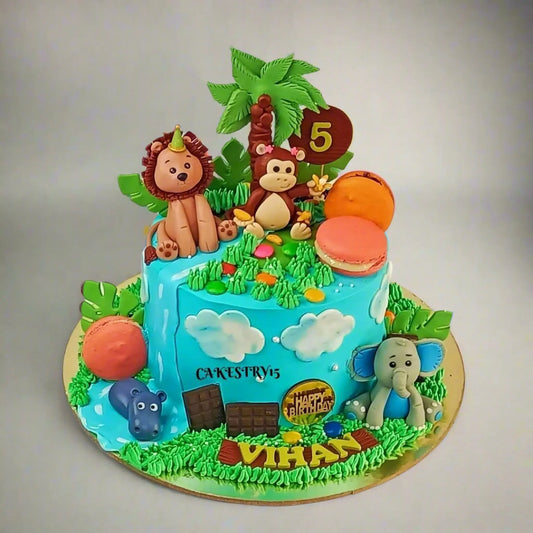 Eggless jungle family kids birthday cake with macarons and safari animals, premium theme cake Noida for kids celebrations