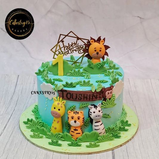 Eggless jungle theme kids birthday cake with safari animals for first birthday celebration in Noida by Cakestry15.