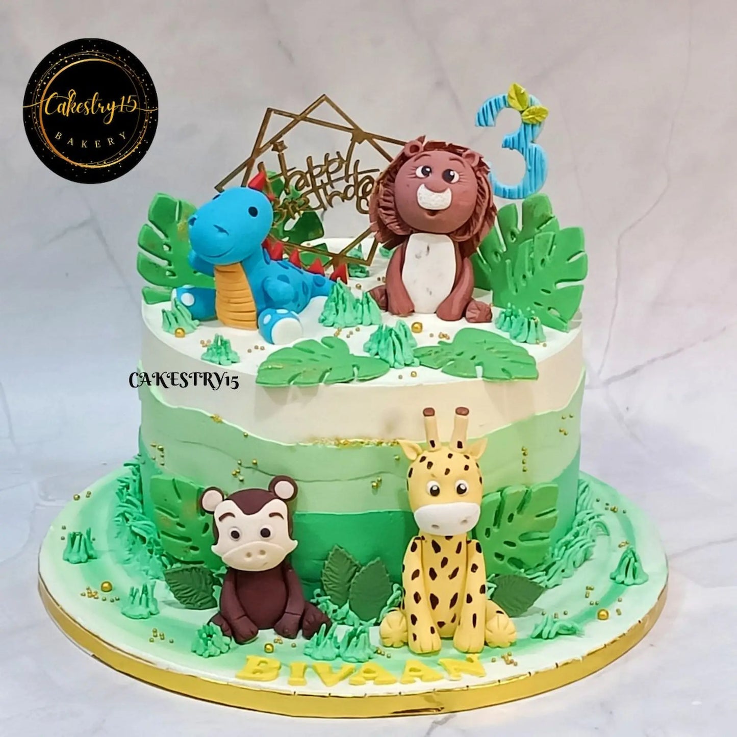 Eggless jungle safari kids birthday cake with fondant animals, premium theme cake Noida for birthday celebrations.