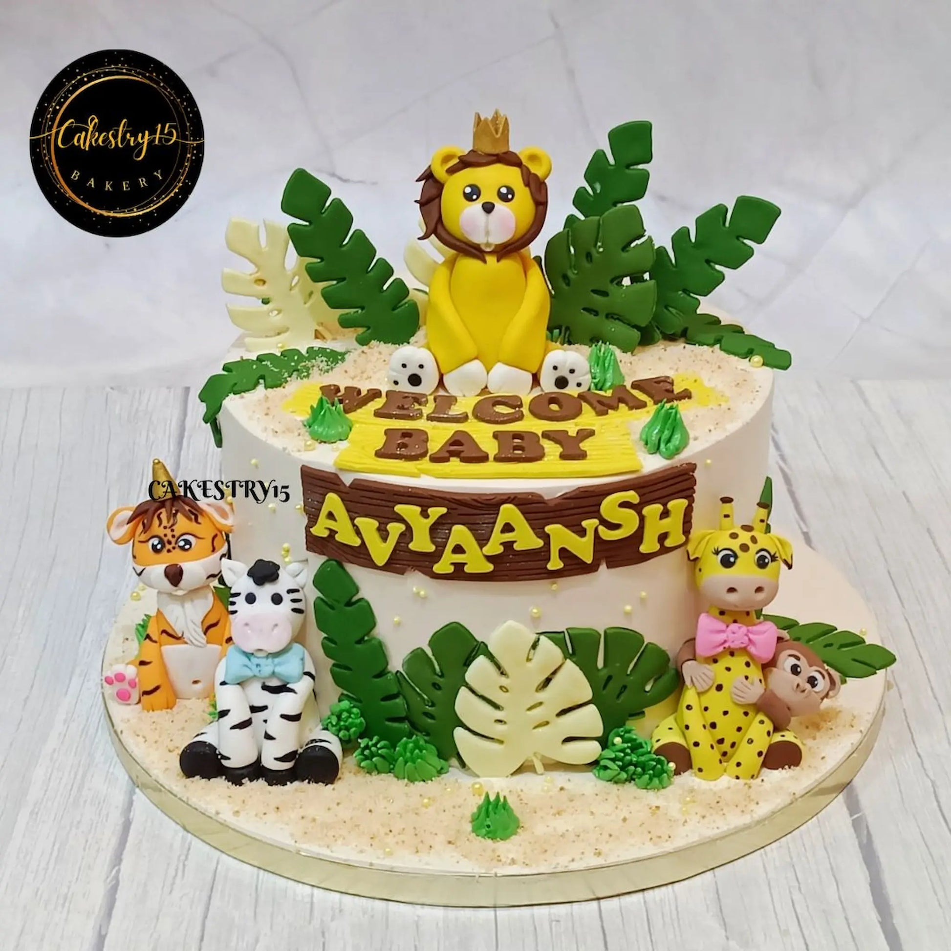 Eggless jungle safari kids birthday cake with fondant animals, premium theme cake Noida for celebrations and custom parties.