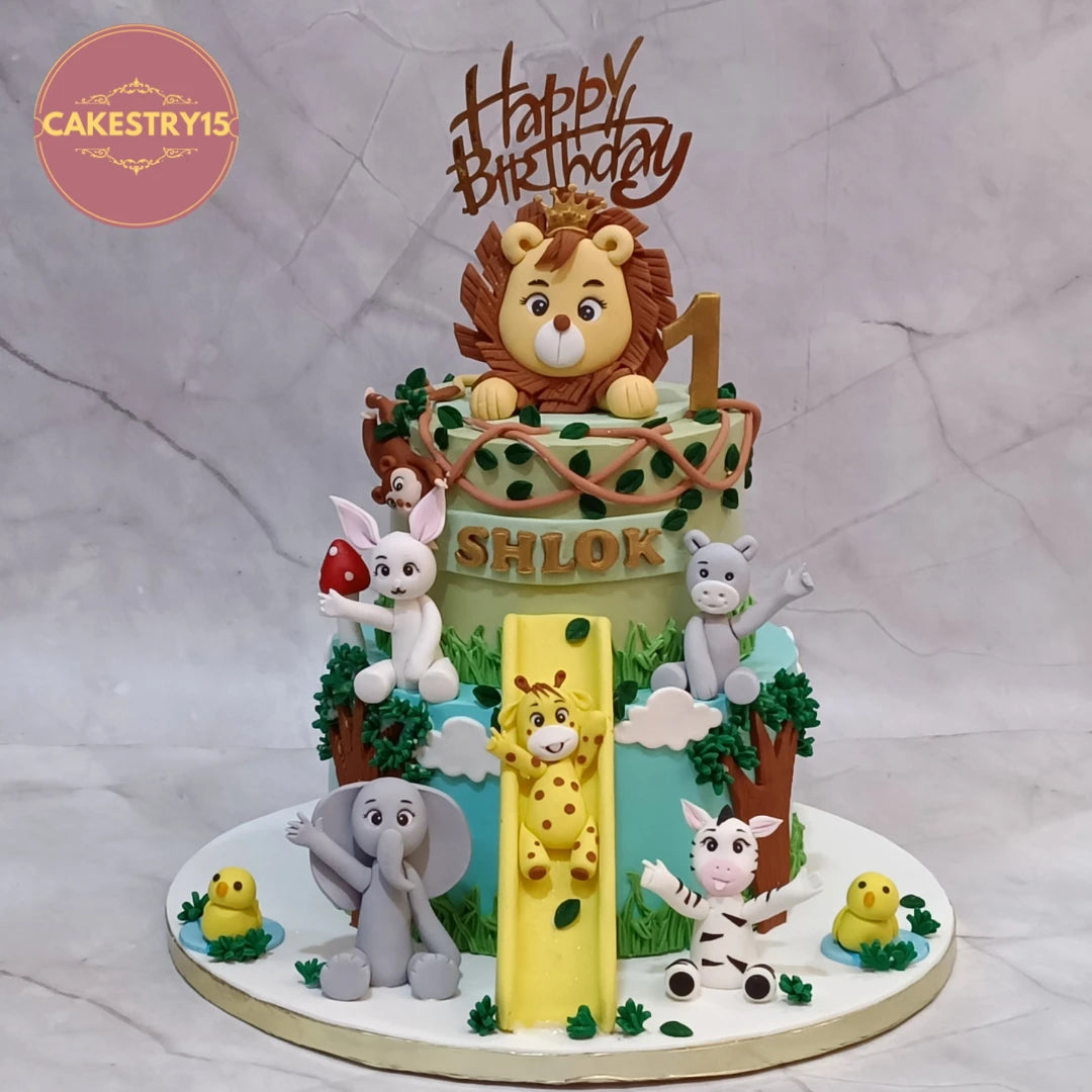 Jungle slide kids birthday cake with animal figurines, a premium theme cake Noida families choose from our collection of custom eggless cakes.
