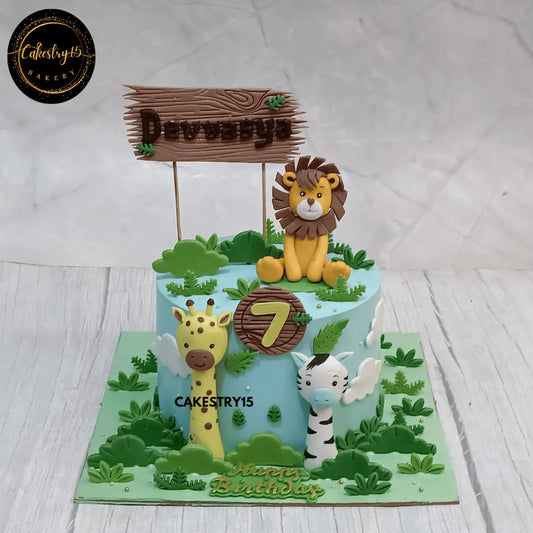 Jungle theme 1kg chocolate birthday cake with lion, giraffe, zebra and name plank

