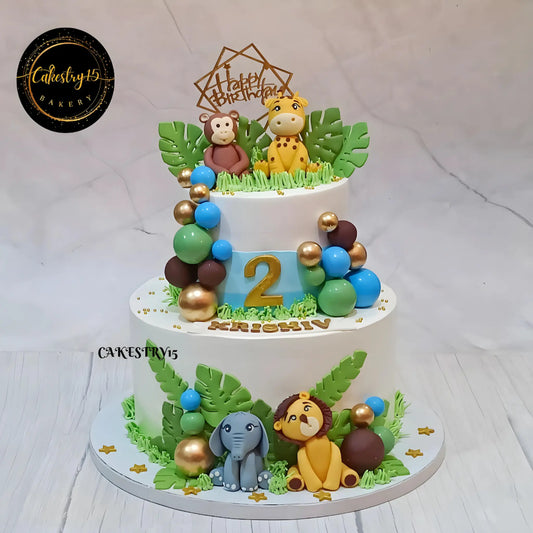Eggless jungle theme kids birthday cake with fondant animals for 2nd birthday celebration in Noida by Cakestry15 theme cake Noida.