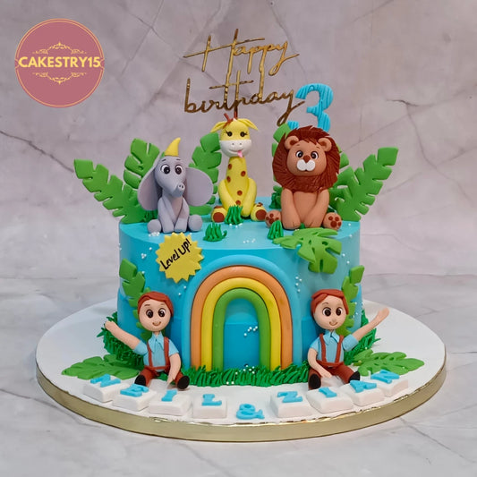 Jungle theme kids birthday cake with lion, giraffe, monkey and elephant, handcrafted as a premium theme cake Noida using fresh 100% eggless cakes.