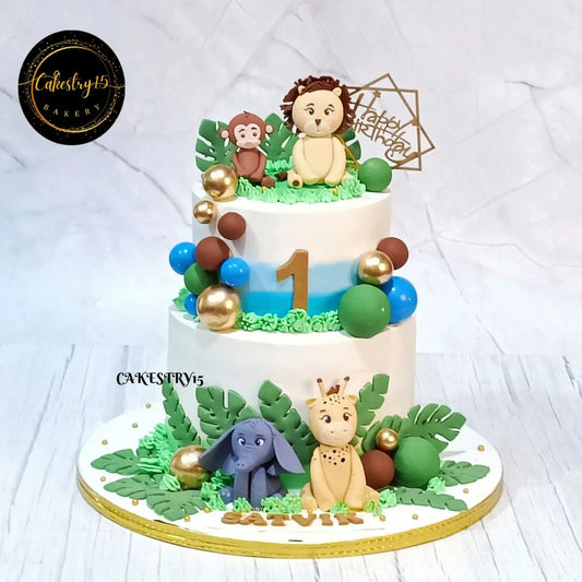 Eggless jungle theme kids birthday cake with animal toppers and pineapple flavour for theme cake Noida celebrations.