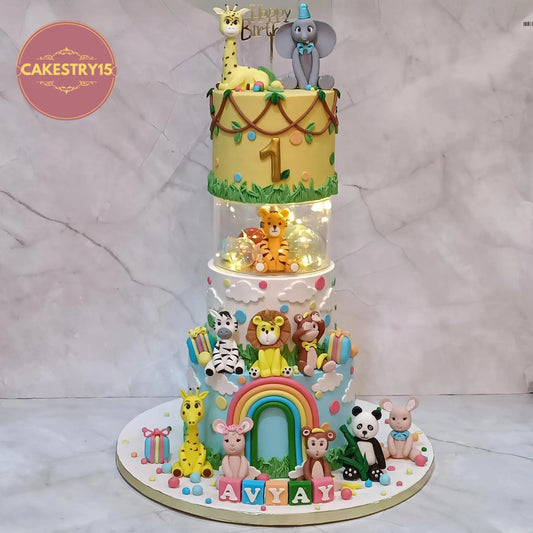 Jungle theme first birthday cake for kids in Noida with animal fondant figures multi tier eggless custom cake for Avyay