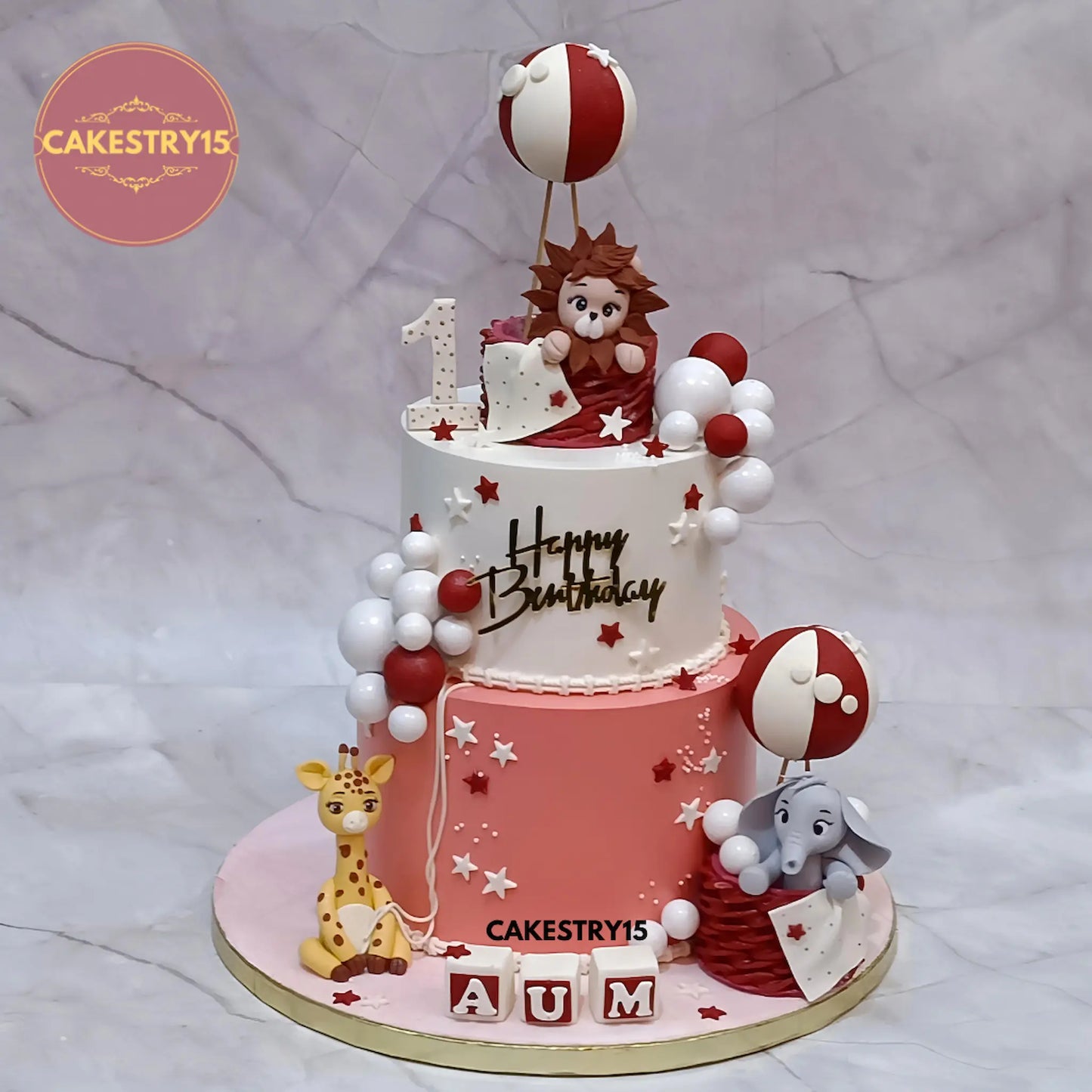 Eggless jungle theme first birthday cake in choco vanilla with lion and elephant design by Cakestry15 in Noida