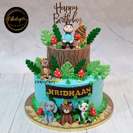 Eggless jungle theme kids birthday cake with fondant animals for first birthday celebration in Noida by Cakestry15.