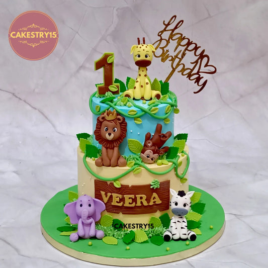 Jungle theme kids birthday cake in Noida with fondant animals, premium eggless chocolate cake for first birthday