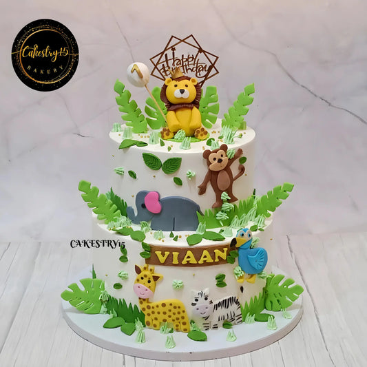 Eggless jungle theme kids birthday cake with fondant safari animals for first birthday celebration in Noida