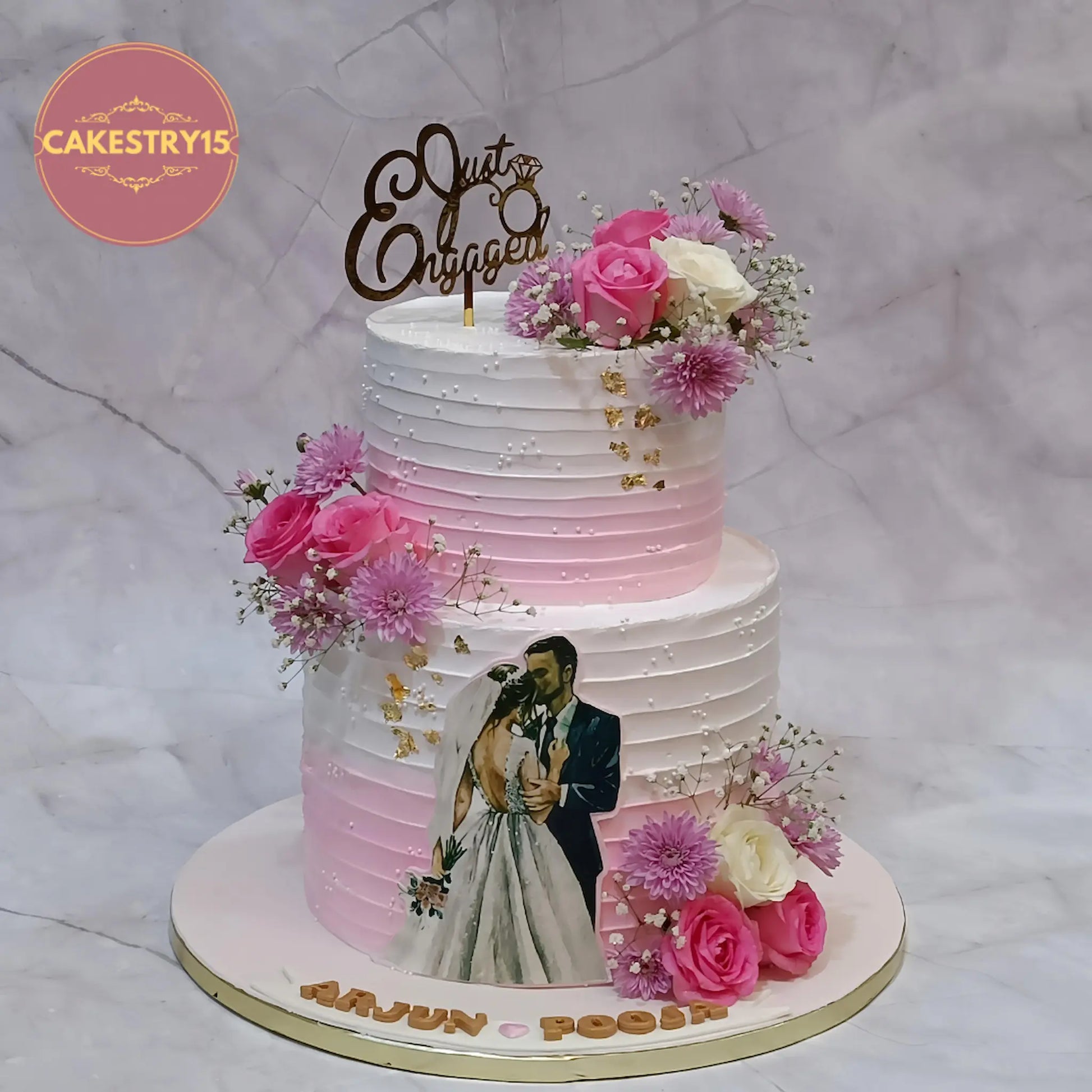 Just engaged 2 tier pineapple flavour engagement cake with pink and ivory floral design by Cakestry15 Noida