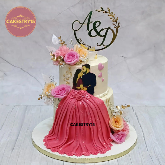 3kg eggless black forest engagement cake with milk chocolate ganache, edible couple picture, fondant red gown, and fresh flowers from Cakestry15 in Noida
