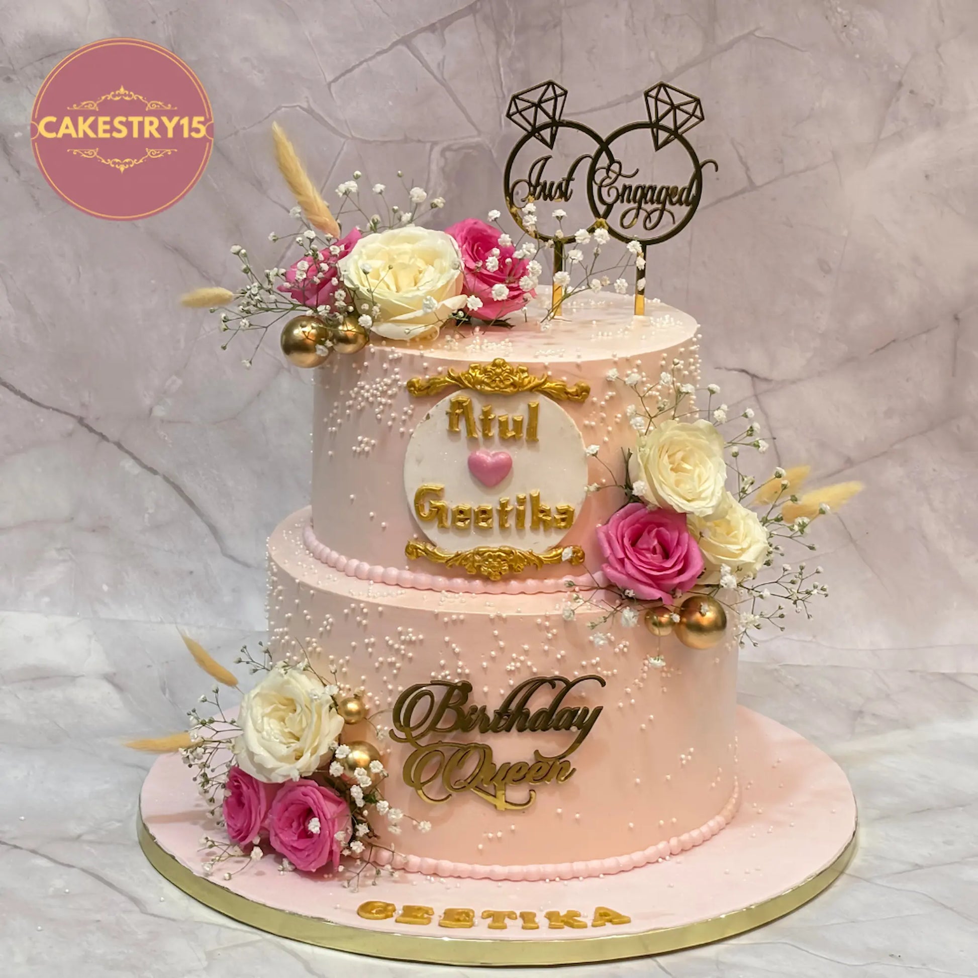 Just Engaged theme eggless engagement cake with ivory and pink fresh roses, pearls, and golden accents by Cakestry15 in Noida
