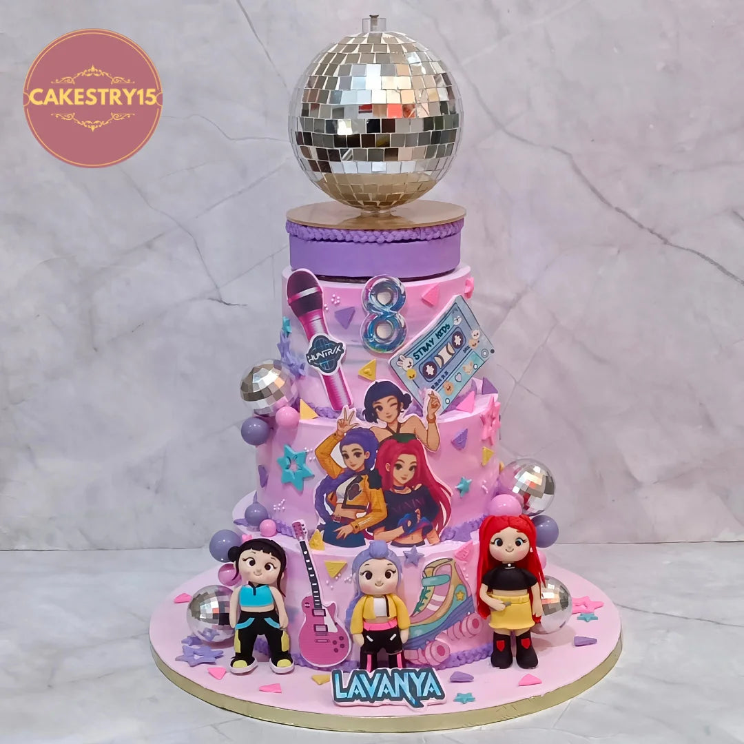 K-Pop kids birthday cake with fondant girls, edible band images and disco details, a premium theme cake Noida made as 100% eggless cakes.