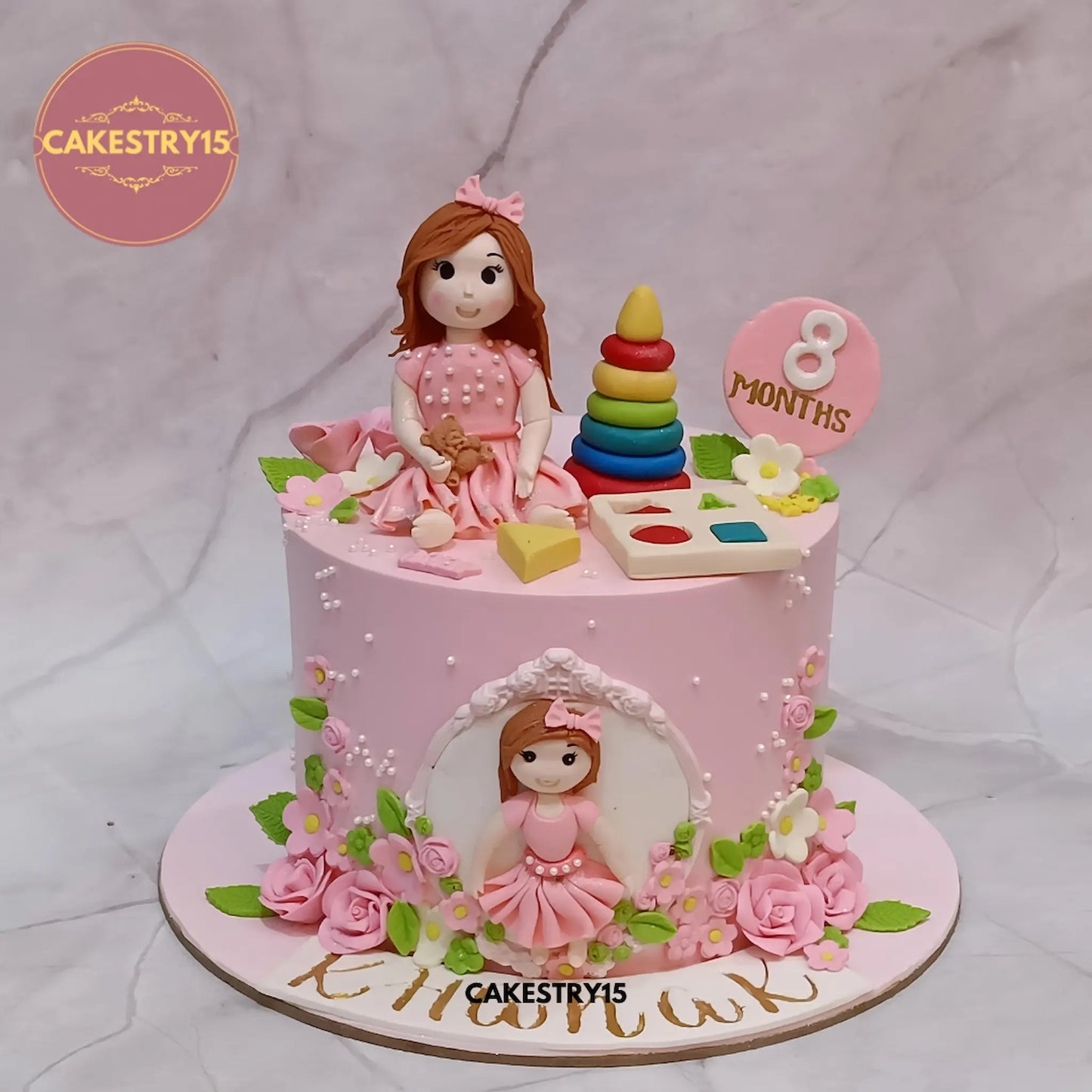 Khanak’s 1kg pineapple baby milestone cake with fondant girl figurines and toy decorations from Cakestry15