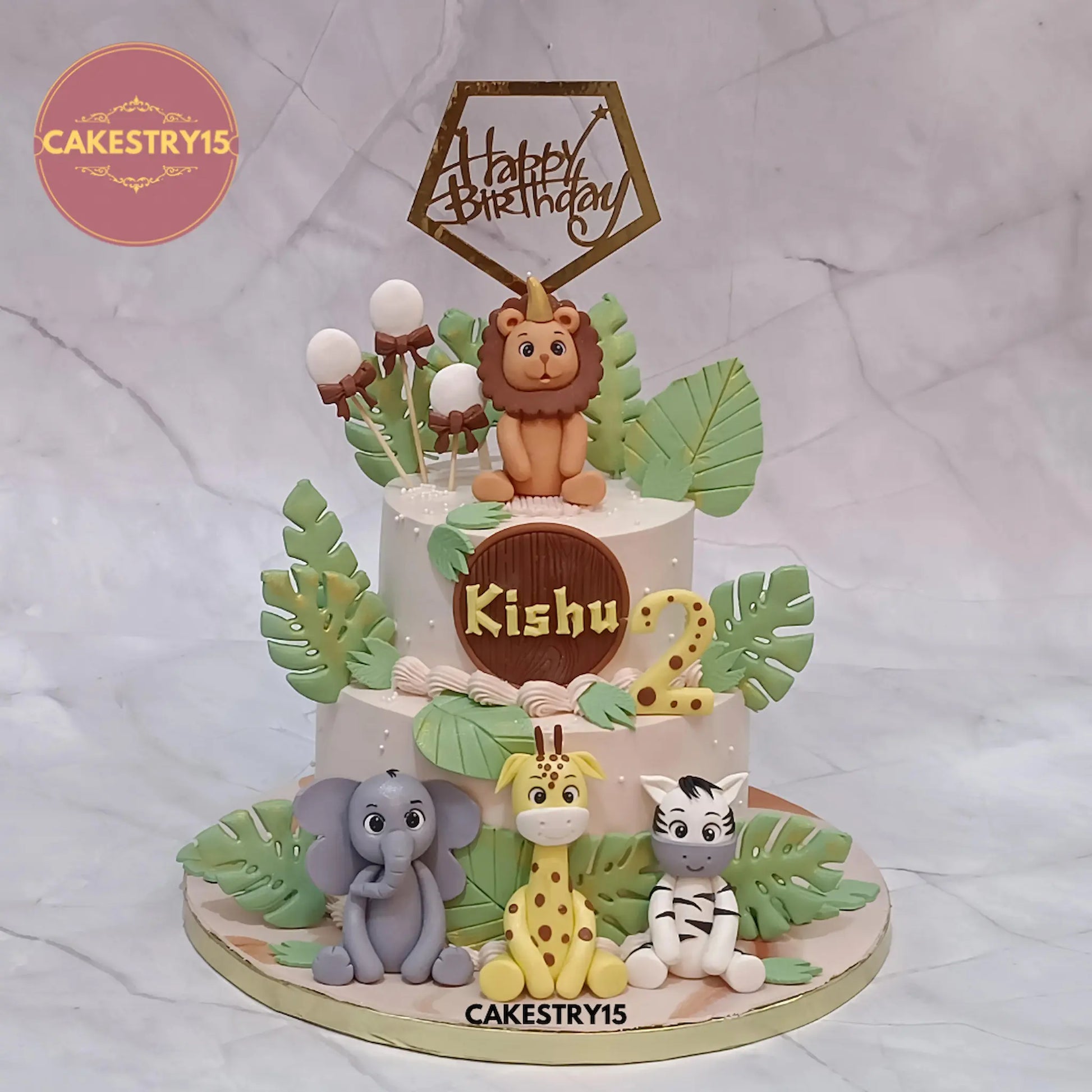 2kg jungle theme butterscotch birthday cake with elephant, giraffe, zebra, and lion toppers from Cakestry15