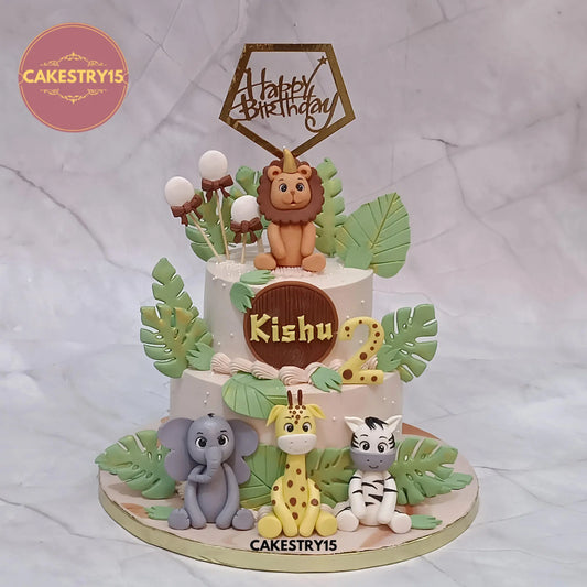 2kg jungle theme butterscotch birthday cake with elephant, giraffe, zebra, and lion toppers from Cakestry15