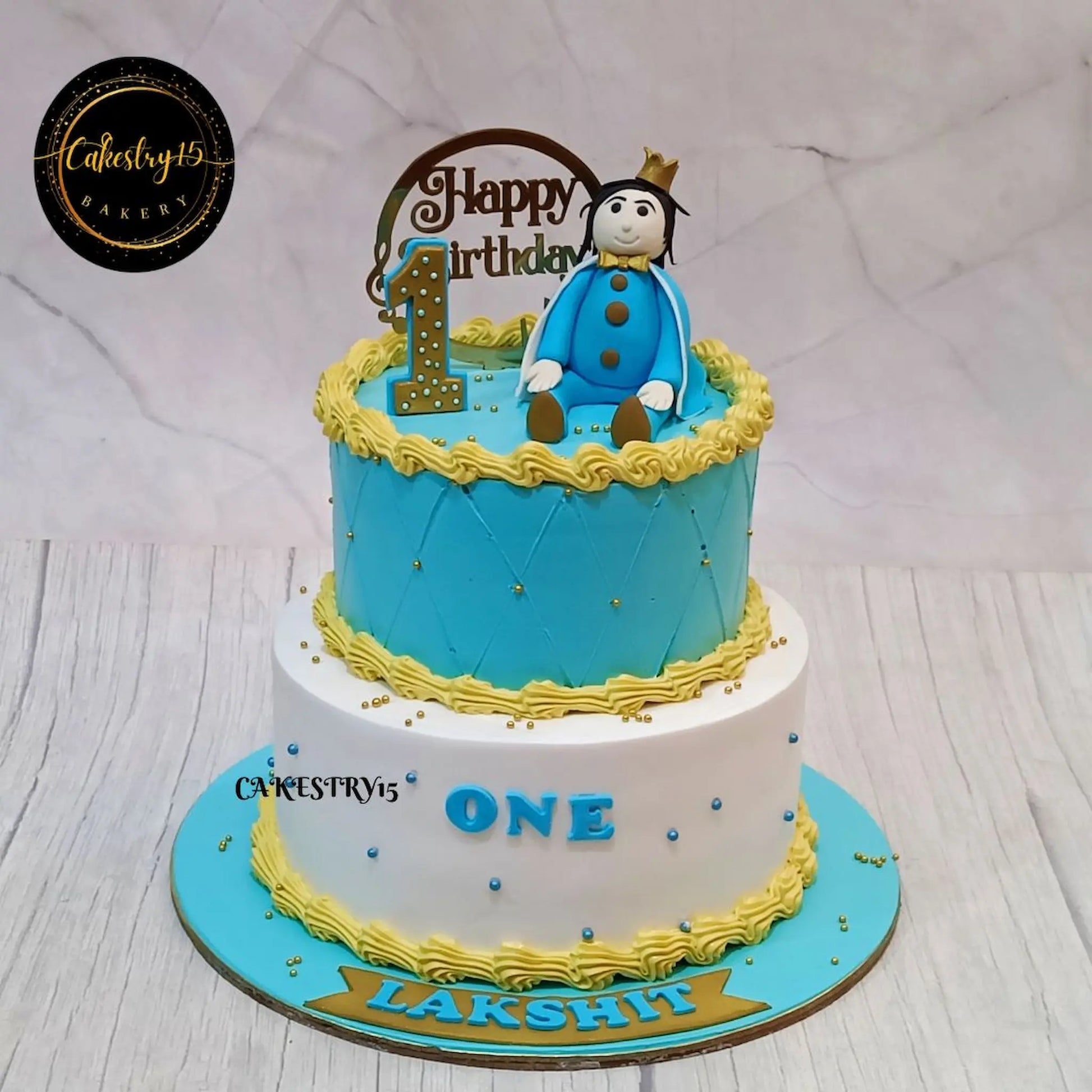 Prince-themed 3kg chocolate cake for Lakshit’s 1st birthday with fondant boy figurine

