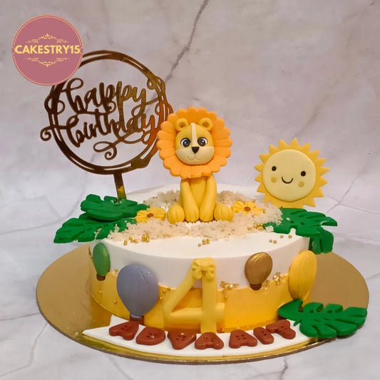Eggless lion theme kids birthday cake in Noida with a smiling sun, green leaf accents and pineapple flavour, perfect for a 4th birthday celebration.