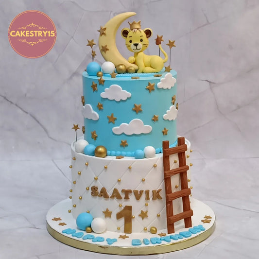 Eggless lion theme kids birthday cake in Noida with moon, stars and clouds for first birthday celebration.