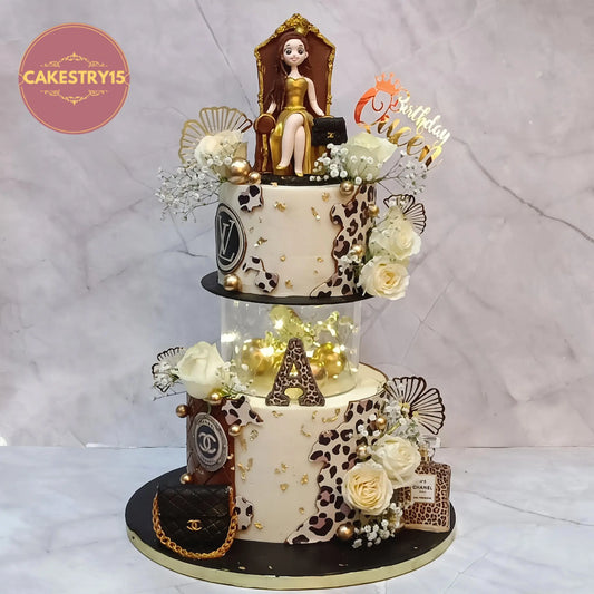 Luxury fashion theme 40th birthday cake with Chanel handbag, LV logo, cheetah print tiers, fresh roses and golden figurine, eggless cake in Noida