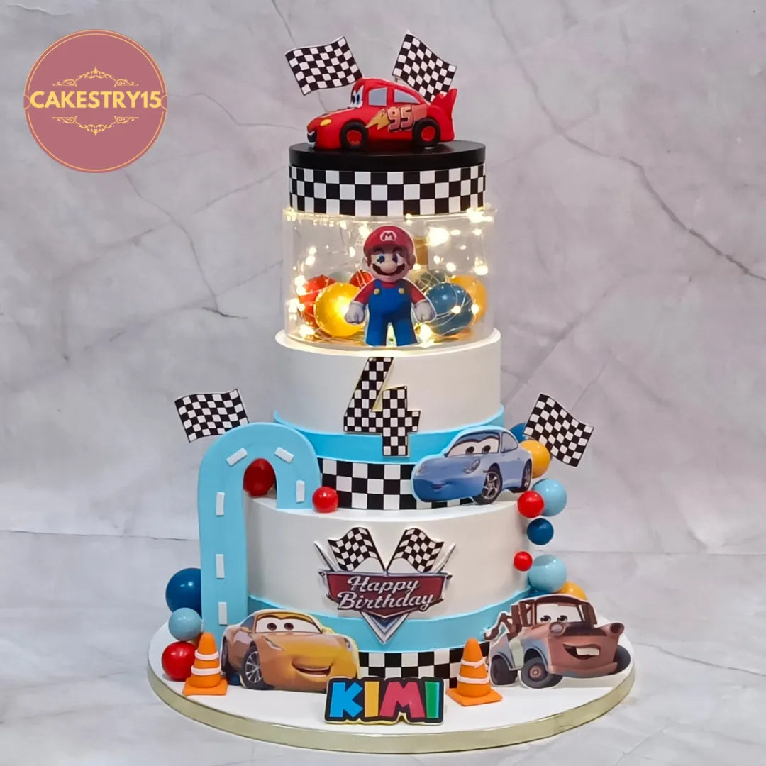 Mario and Cars fusion kids birthday cake with rotating fondant car, theme cake Noida made as premium eggless cakes.