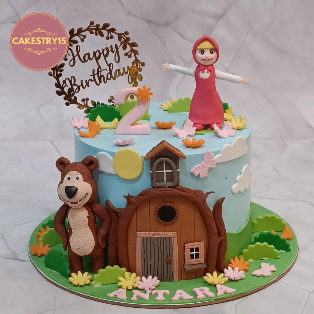 Masha and the Bear Floral Garden kids birthday cake featuring fondant characters, flowers and house details, crafted as premium eggless cakes and theme cake Noida.