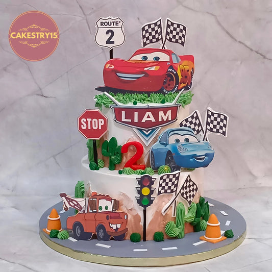 McQueen Cars kids birthday cake with a racing road design from an eggless cakes bakery offering a theme cake Noida.