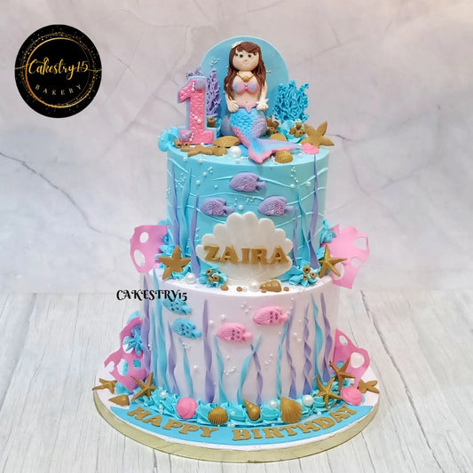 A Mermaid Aqua kids birthday cake in Noida featuring an elegant eggless cakes design for a memorable first birthday celebration.