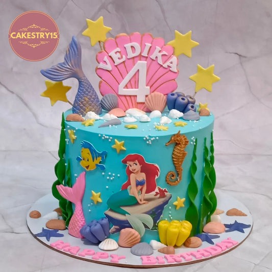 Mermaid coral reef kids birthday cake with underwater details from an eggless cakes bakery offering a theme cake Noida.