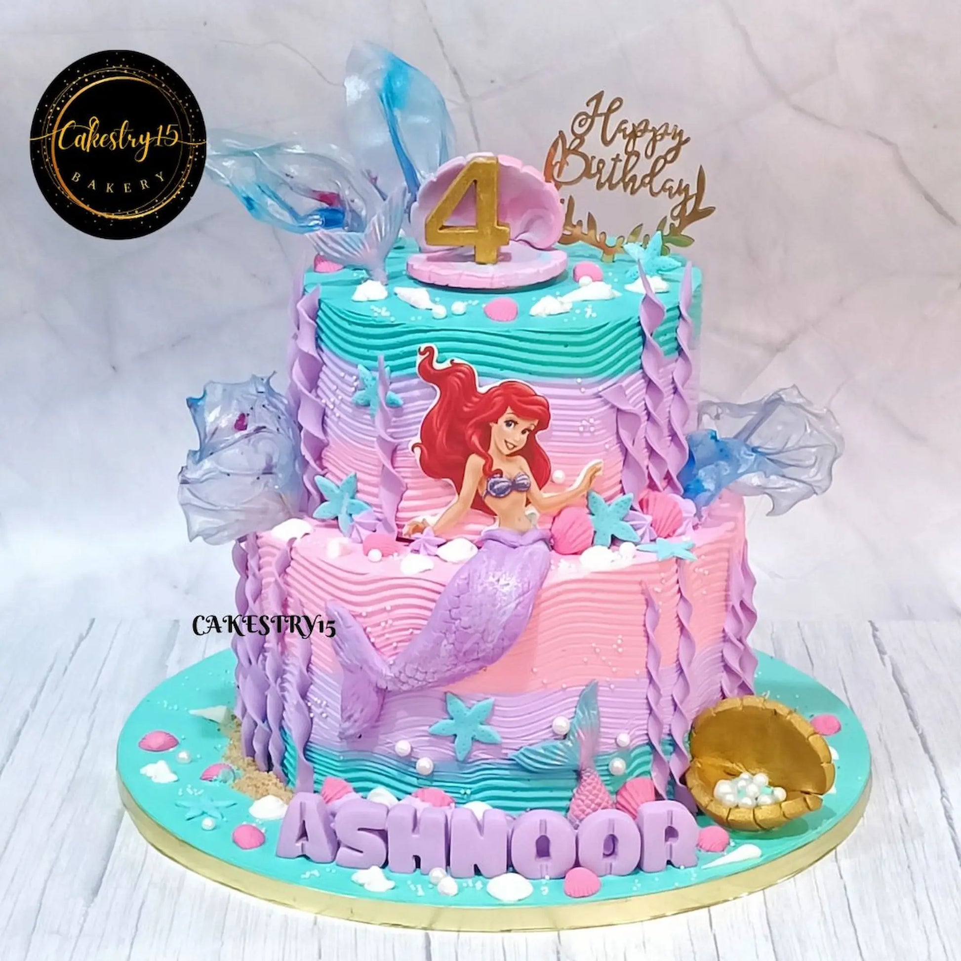 Mermaid swirls kids birthday cake with ocean details from an eggless cakes bakery offering a theme cake Noida.