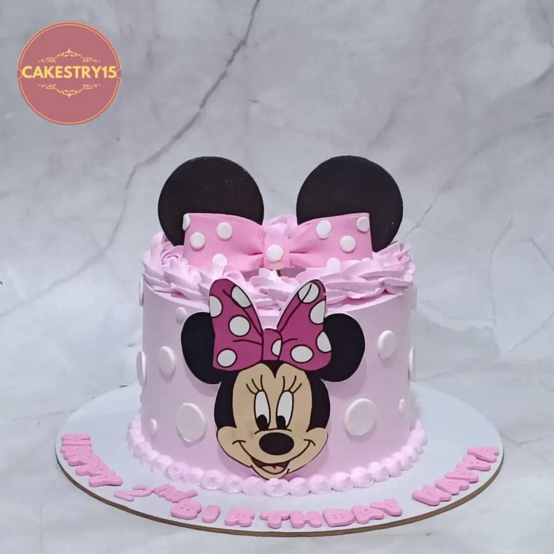 Eggless Minnie Mouse kids birthday cake with polka dots and fondant bow, premium theme cake Noida for girls birthday celebrations.