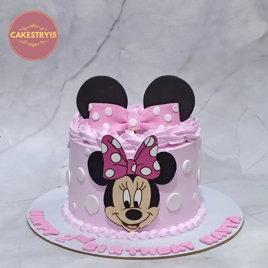 Eggless Minnie Mouse kids birthday cake with polka dots and fondant bow, premium theme cake Noida for girls birthday celebrations.