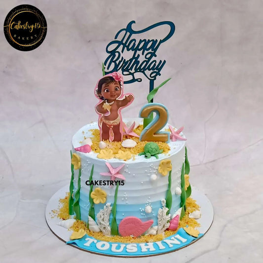 Moana-themed 2nd birthday cake with an edible baby Moana figurine, coral decorations, and a pineapple flavor by cakestry15 noida, best bakery noida