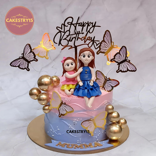 Eggless Mom With Kid theme pineapple birthday cake for mom and wife with figurine and golden accents in Noida