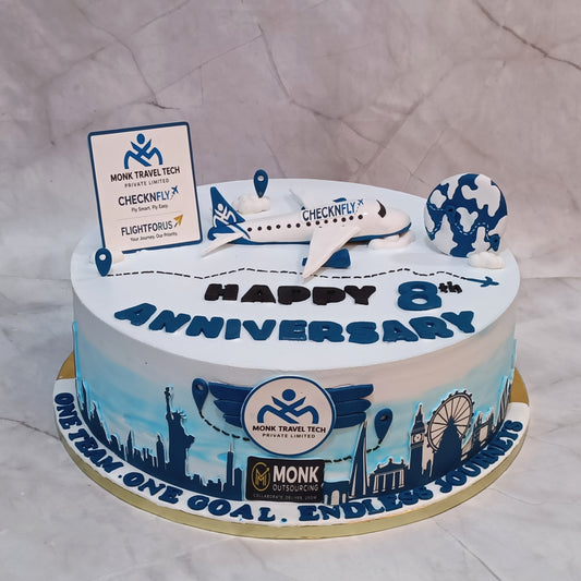 Premium eggless corporate anniversary cake with airplane, globe and company branding, handcrafted as a designer cake in Noida for business celebrations.
